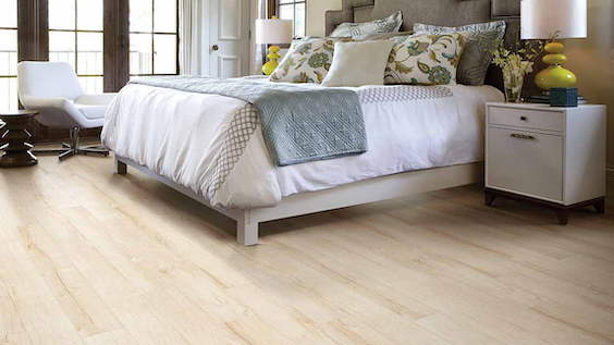 warm toned wood look laminate planks in a bedroom