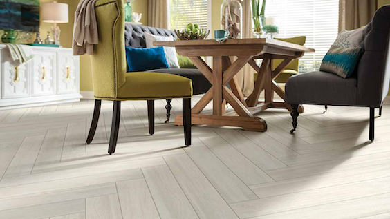 soft, neutral wood look tile flooring in a dining room